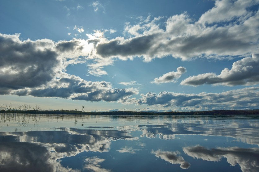 Blue sky and Clouds over Body of Water